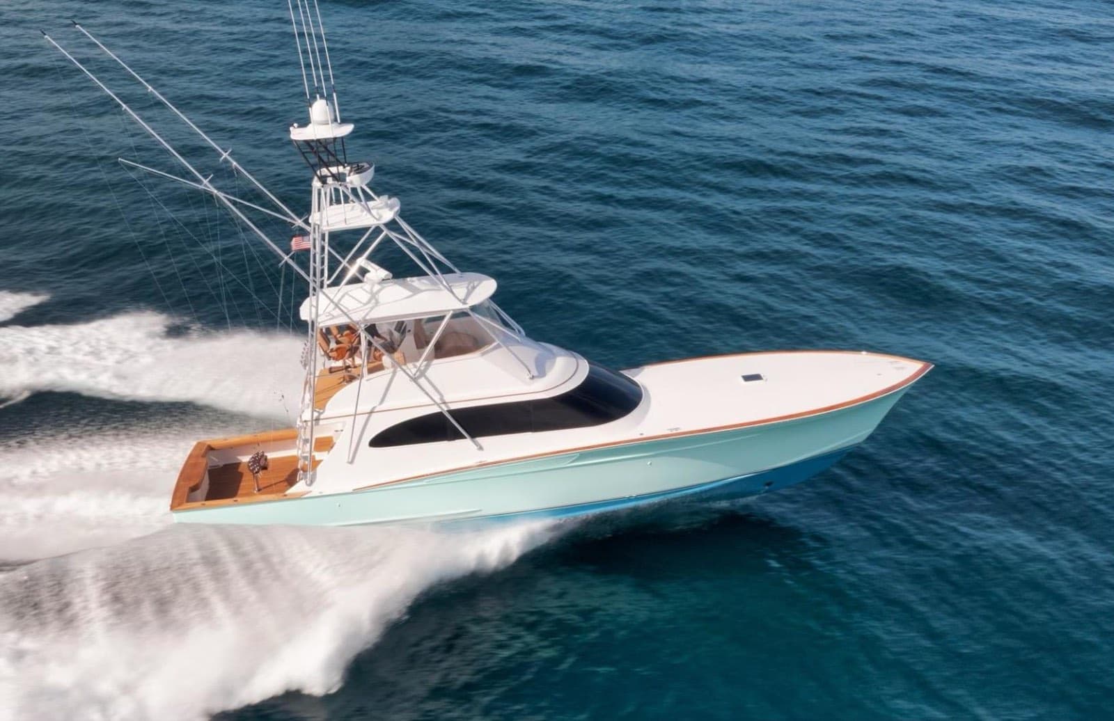 A custom express sportfish running offshore, seen from above the bow